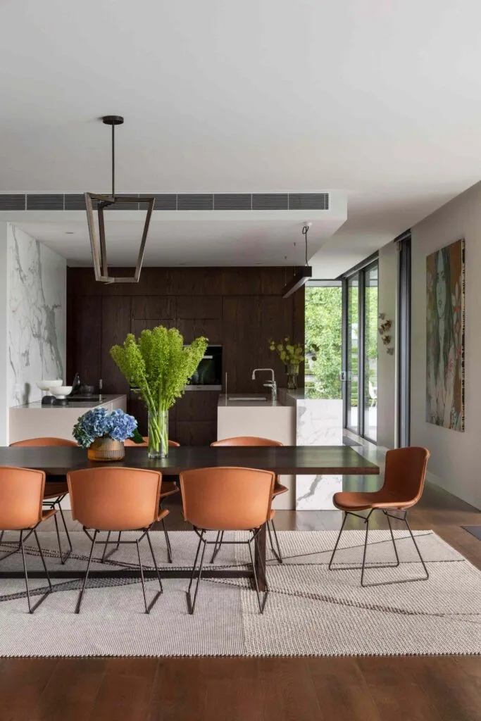Kitchen and dining room with flowers and artwork