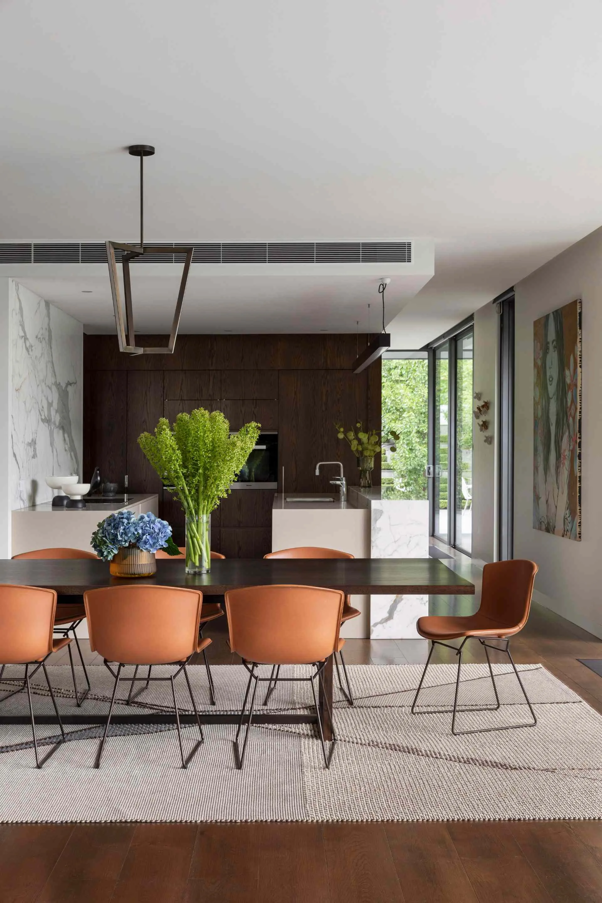 Kitchen and dining room with flowers and artwork