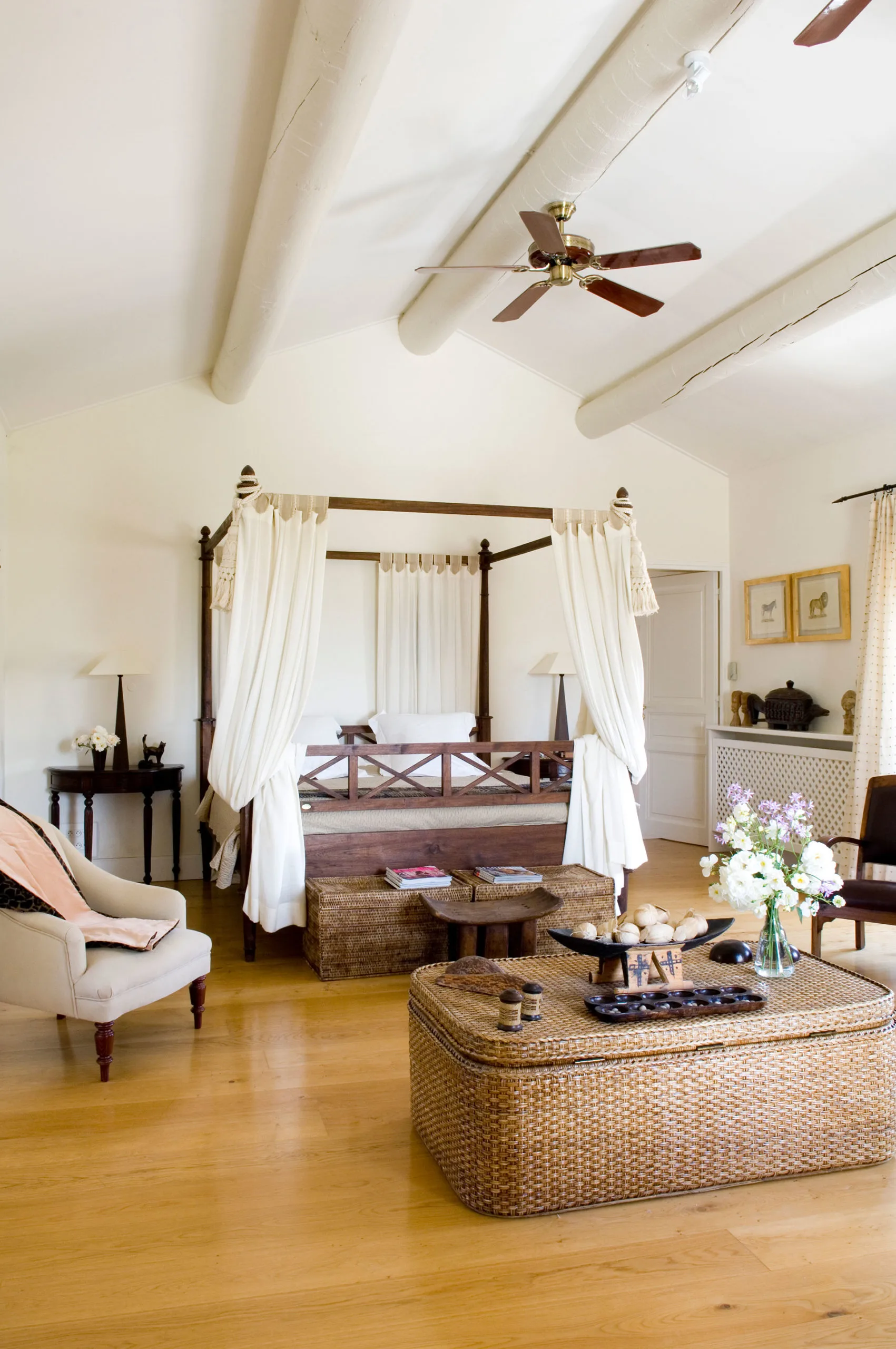 A villa bedroom with summer fans on the roof