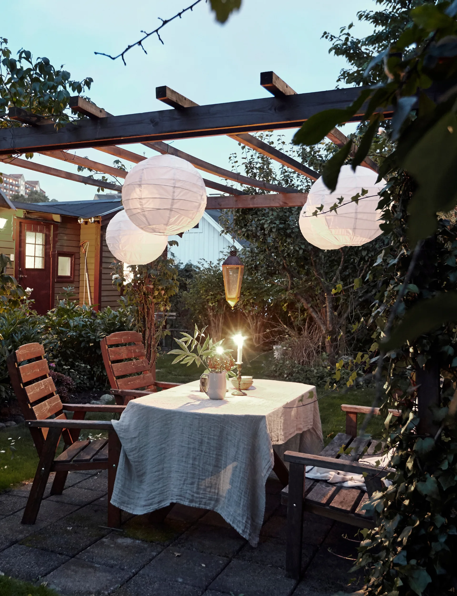 Outdoor lights above an outdoor dining table