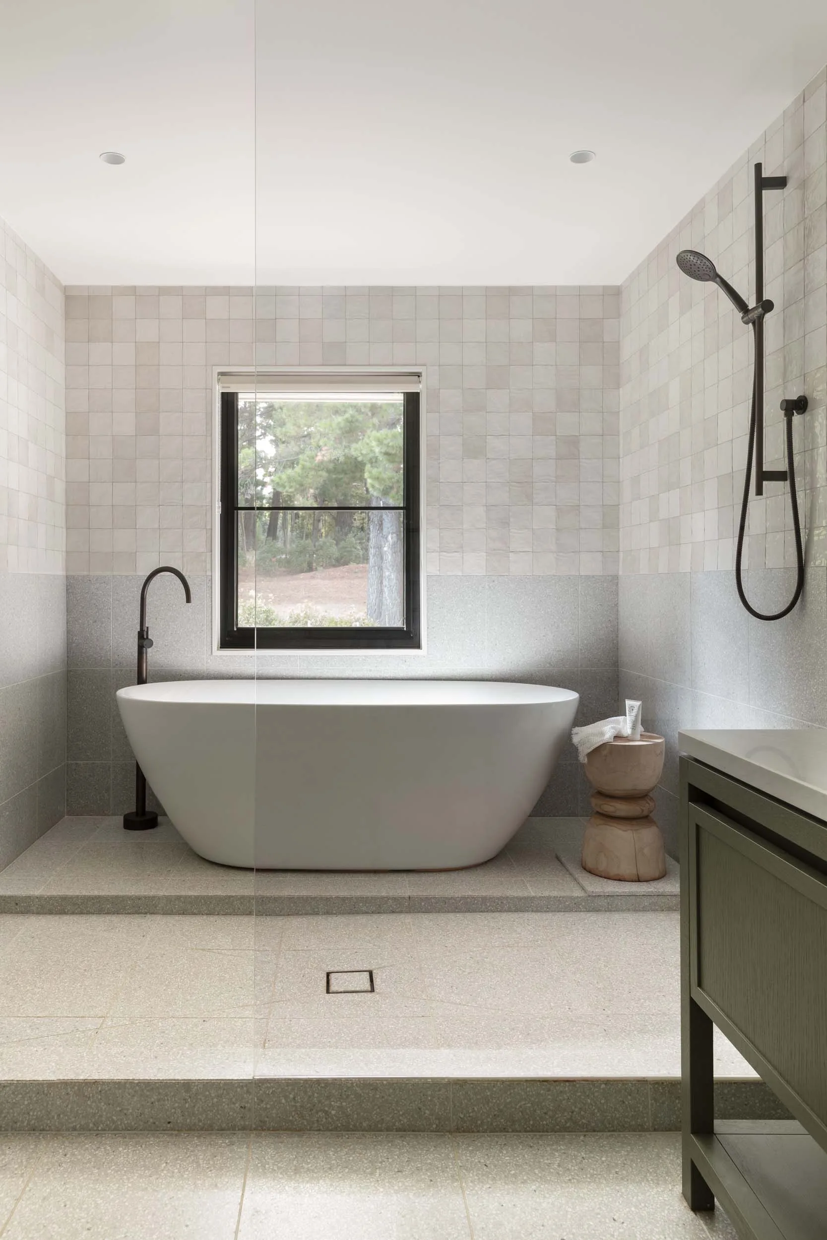 In the farmhouse renovation, the bathroom received a modern update