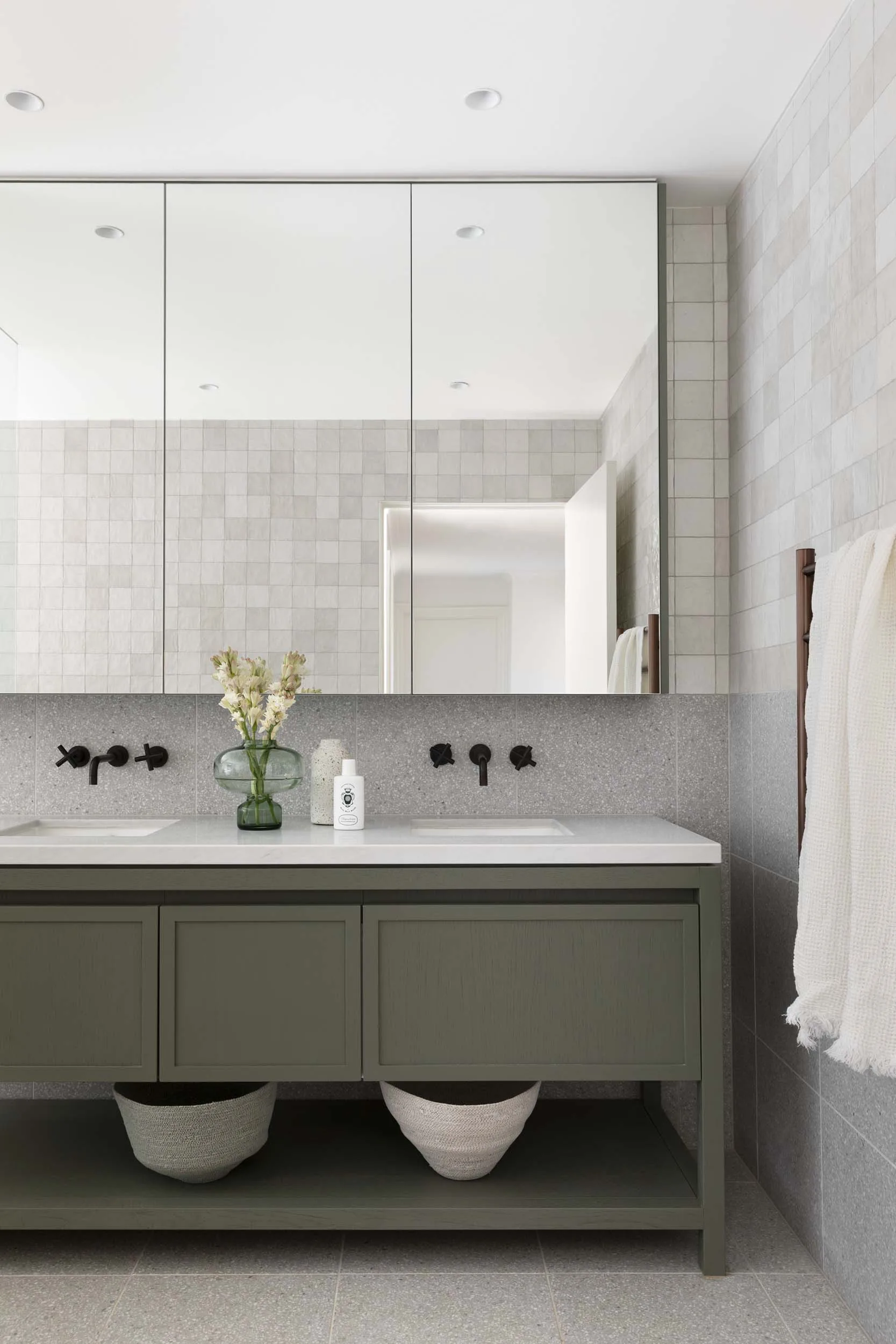 In the farmhouse renovation, the bathroom received a modern update
