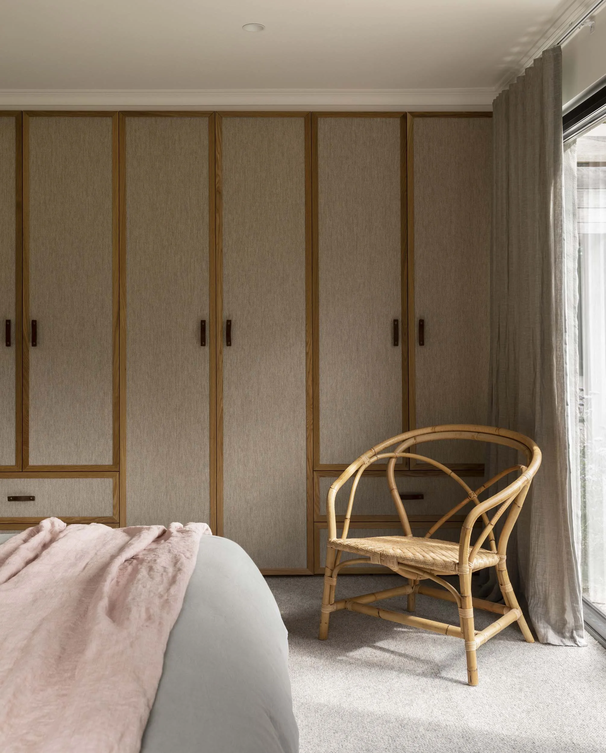 The master bedroom with fabric wardrobe doors
