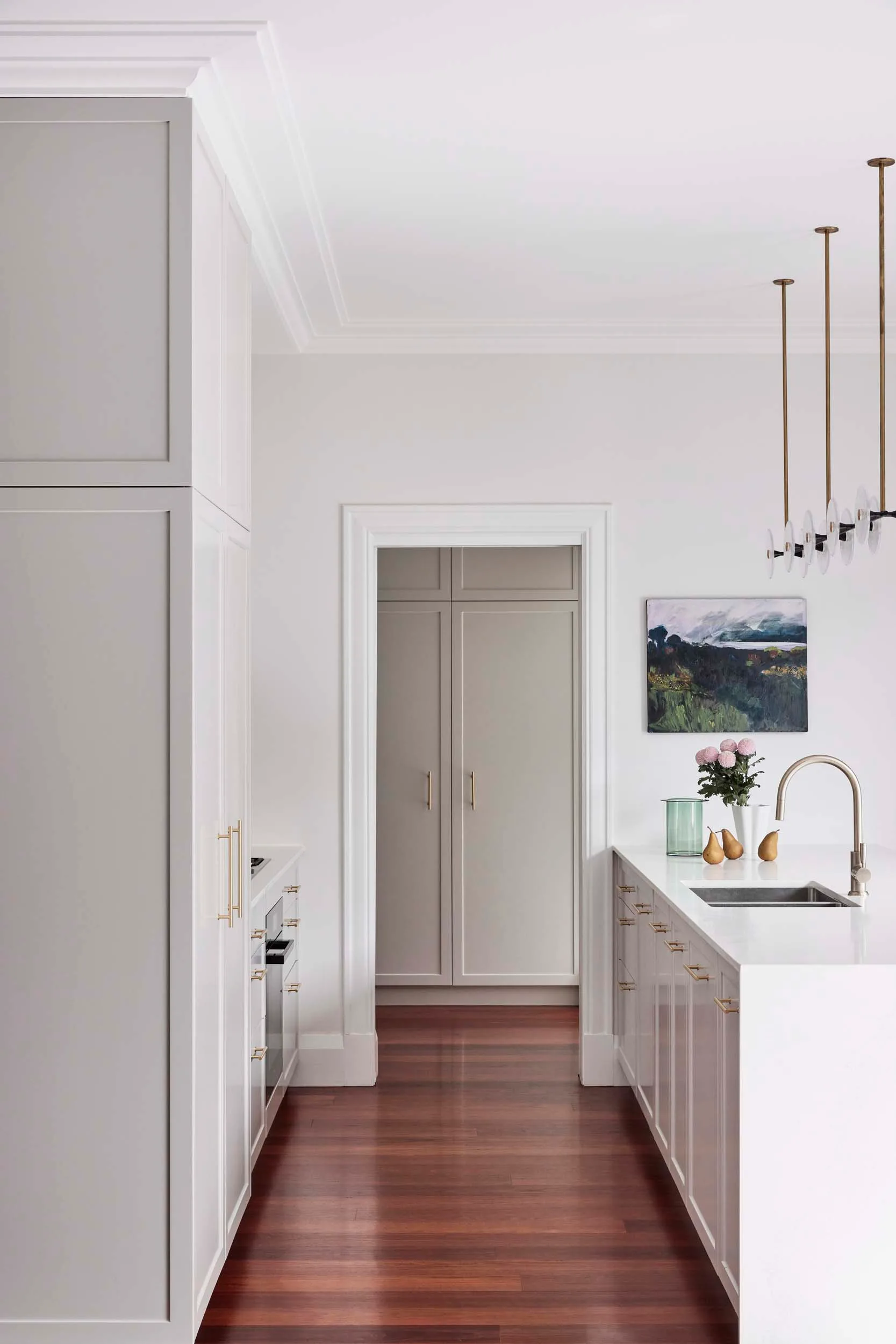 The kitchen between the island and back bench