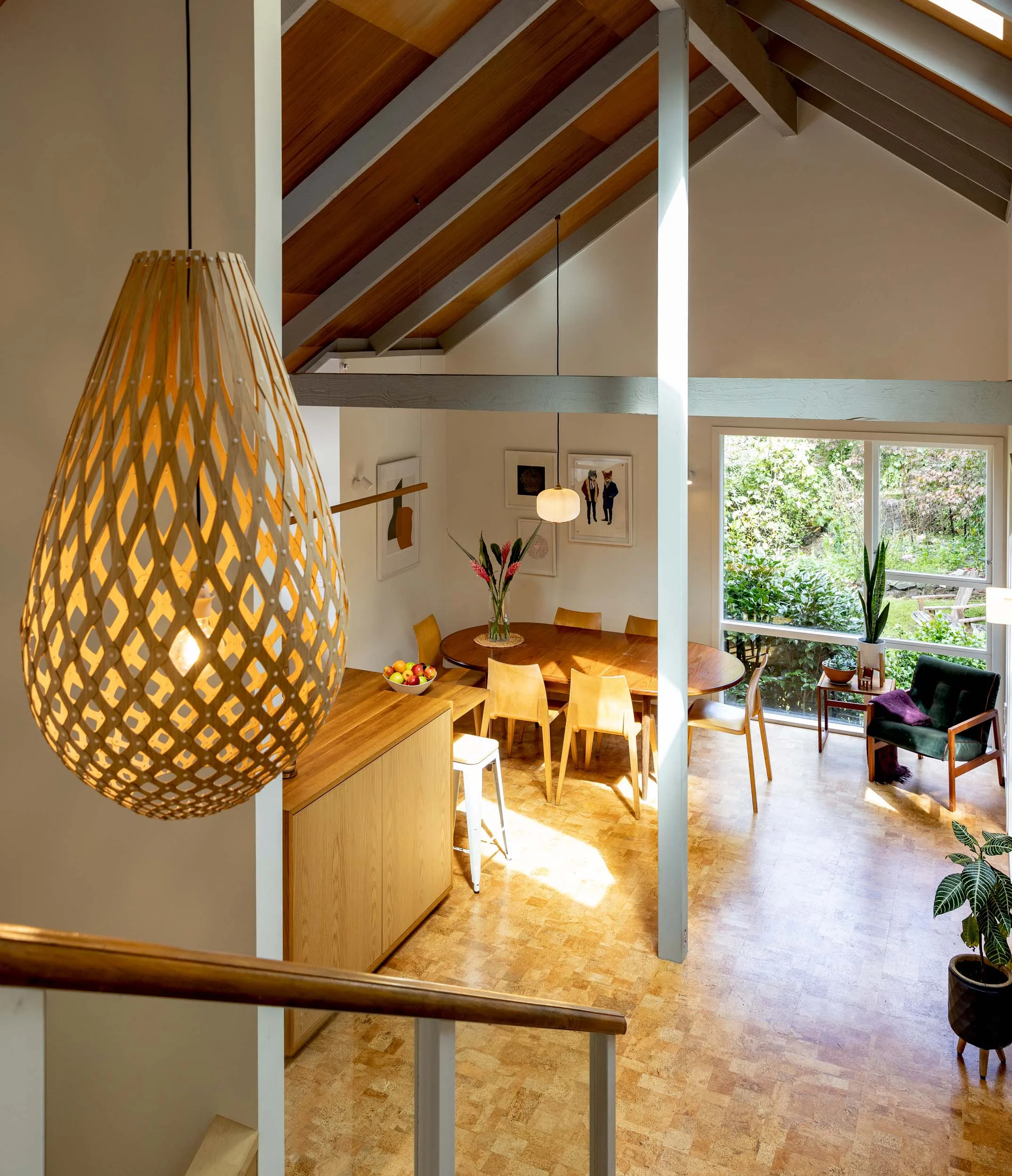 A view down into the dining room from the top of the stairs