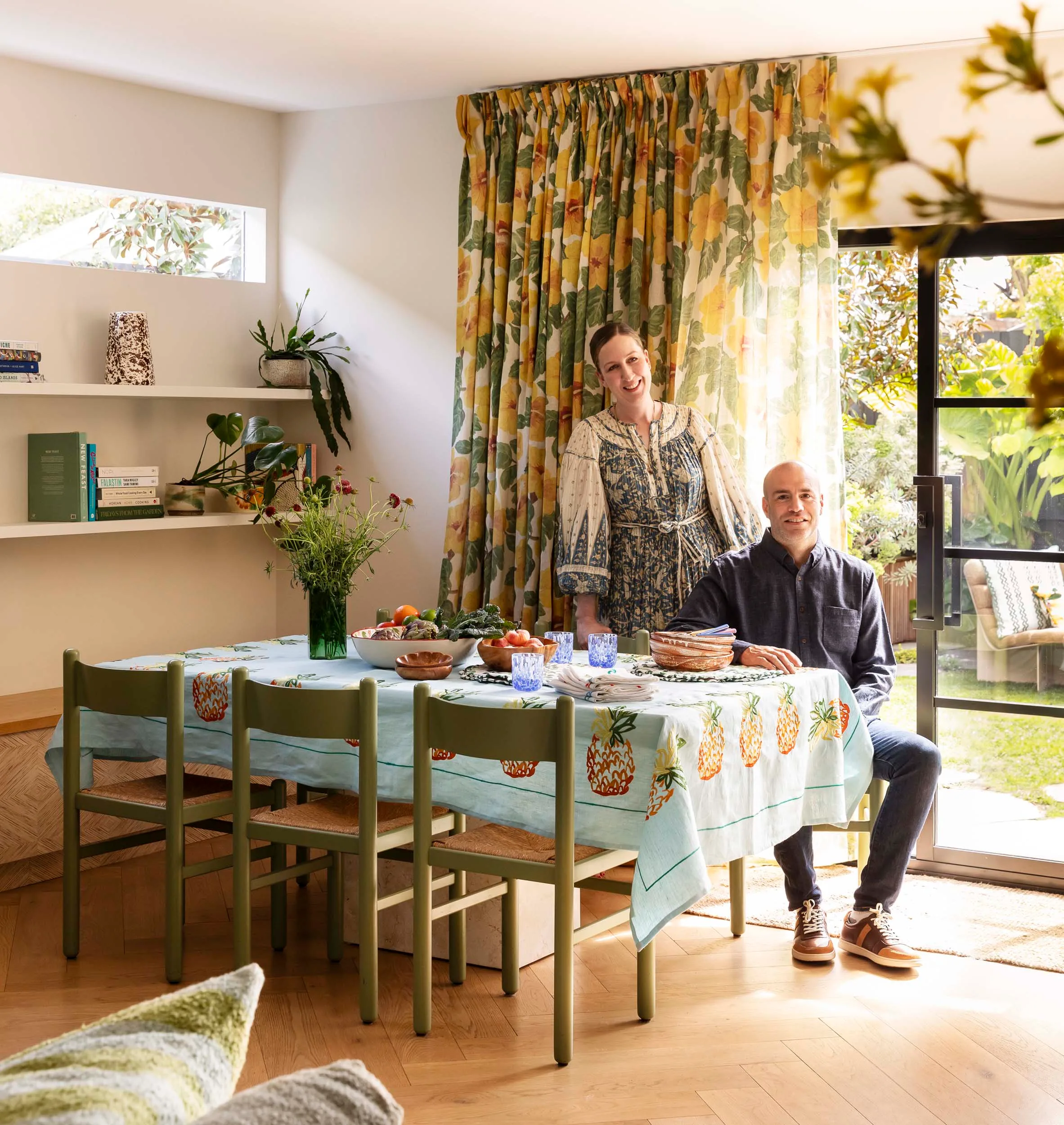 Homeowners sitting at their colourful table
