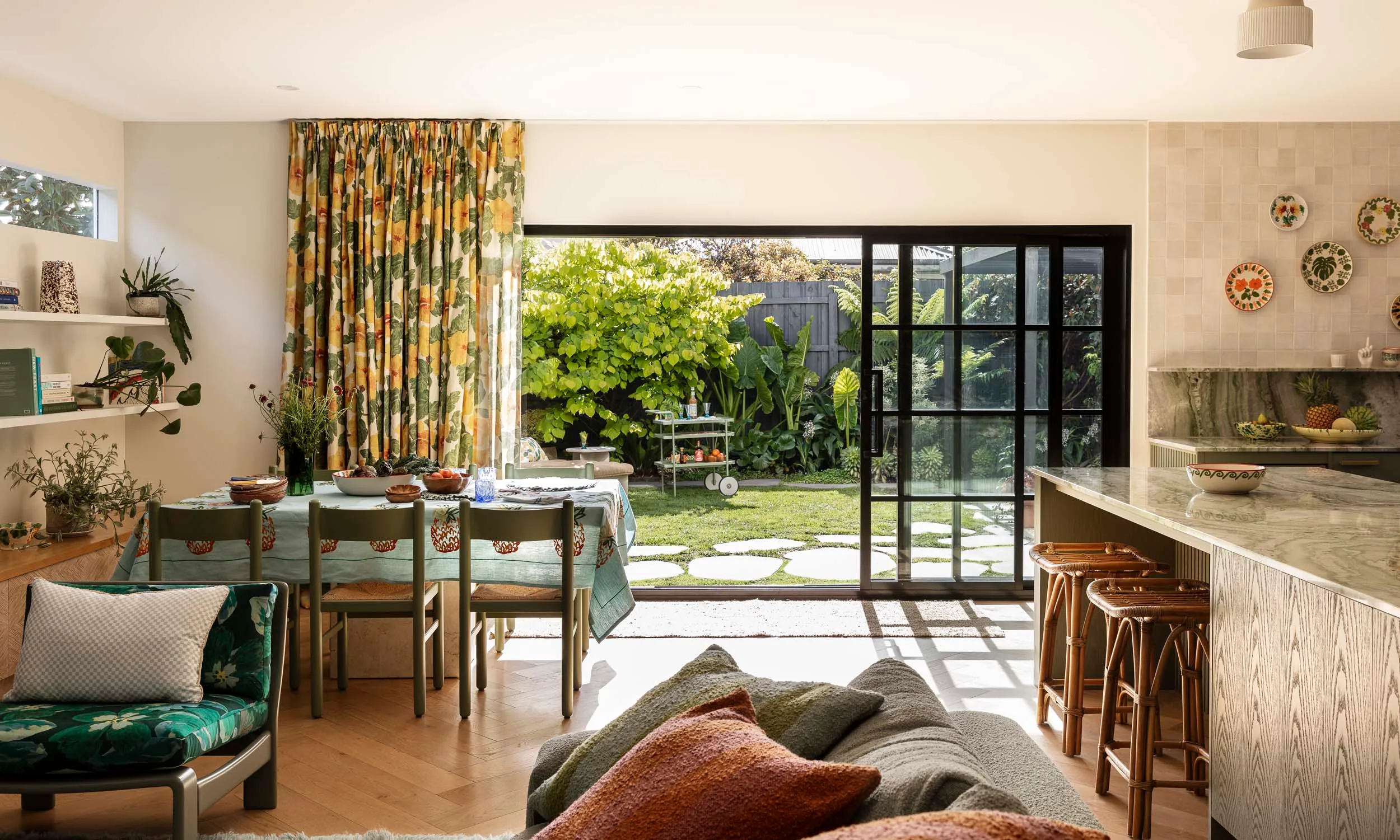 A view of the kitchen and dining room table side-on