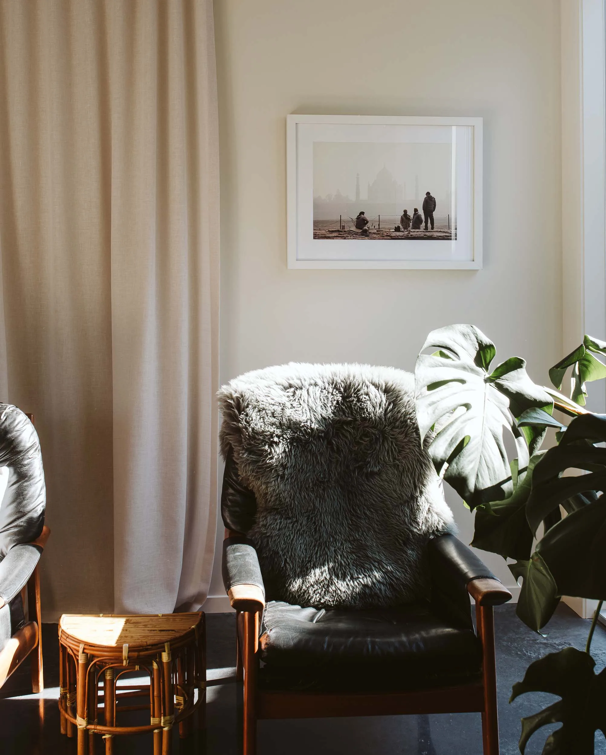 The lounge of a Taranaki home with a black leather arm chair