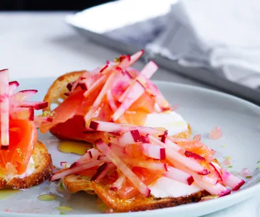 Salmon crostini with pickles and crackers