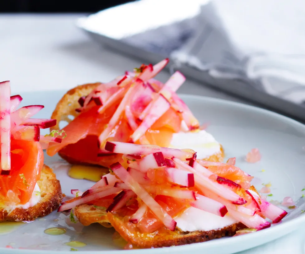Salmon crostini with pickles and crackers