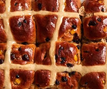 Best hot cross buns recipe - Seven hot cross buns with glazed tops and sticky fruit filling.