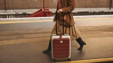 Antler suitcase on train platform