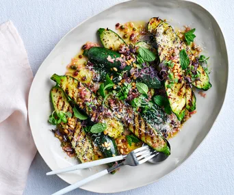 Charred zucchini agrodolce with ricotta salata and basil