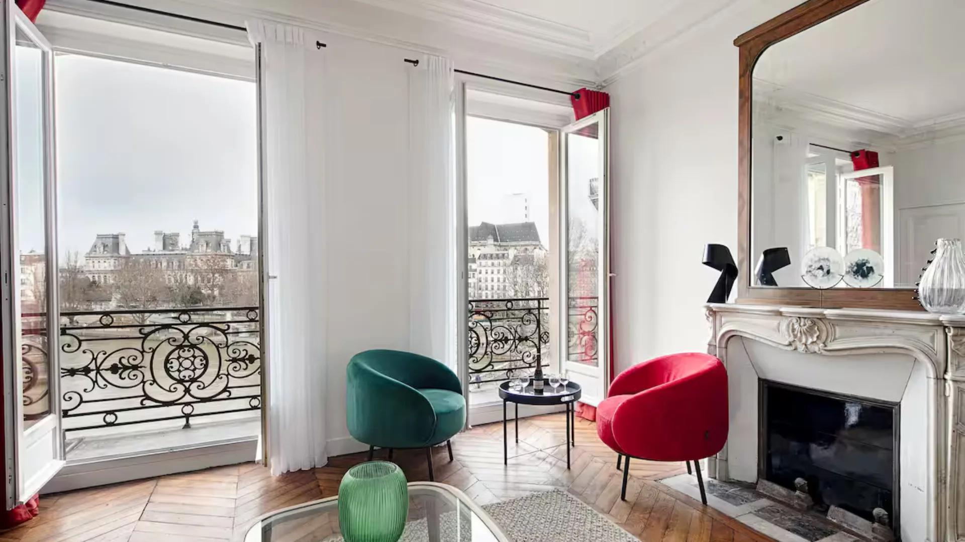 The living room with views of the Seine at the amazing apartment in Paris.