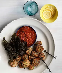 Keftedes with tomato, mint and parsley and crisp vine leaves