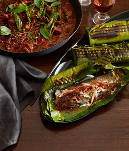 Martin Boetz: Grilled rainbow trout fillets with curry paste, young coconut and lime leaves