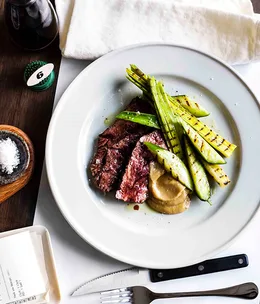 Hanger steak with charred cucumber and garlic purée