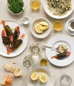 Fragrant lemon barley couscous with mullet in vine leaves