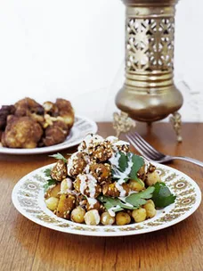 Fried cauliflower with onion, currants and pine nuts