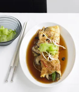 Asparagus and shiitake omelette with black bean and ginger broth and pickled cucumber