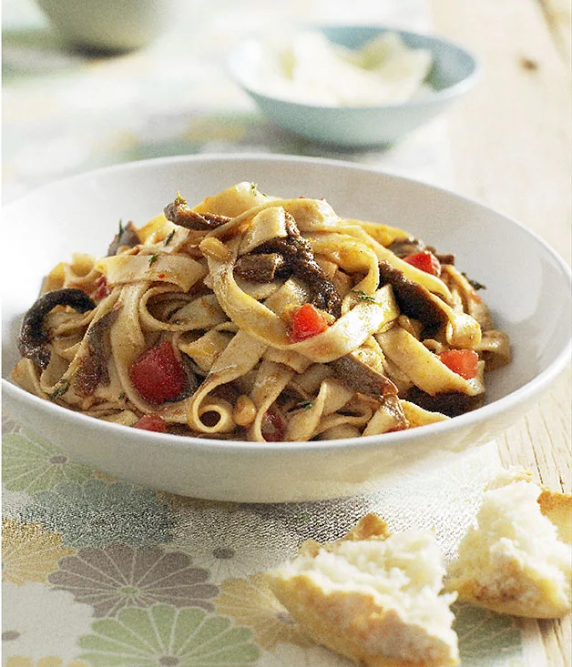 Tagliatelle with porcini, pine nuts, fresh tomato and thyme