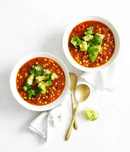 Corn soup with avocado and lime