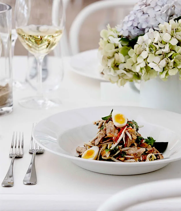 Poached chicken and coconut salad with smoked quail’s eggs and Asian herbs