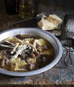 Oxtail broth with fresh pasta squares and dried wild forest mushrooms