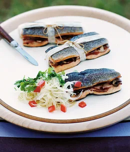 Barbecue trout bundles with prosciutto and button mushrooms