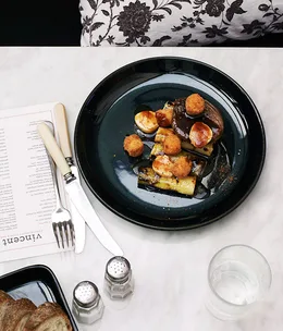 Grilled leek and braised onion “poutine”