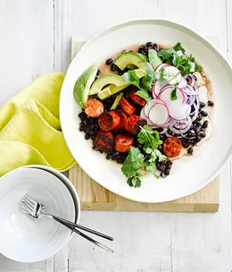 Grilled chorizo with black bean and avocado salad