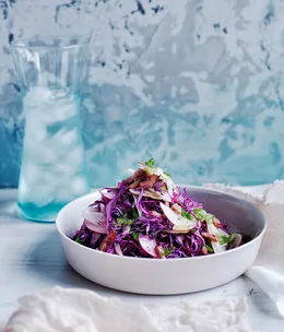 Red cabbage-apple slaw with speck and caraway dressing