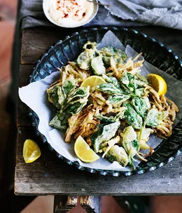 Spring onion fritters and crisp broad bean leaf tips with preserved-lemon mayonnaise