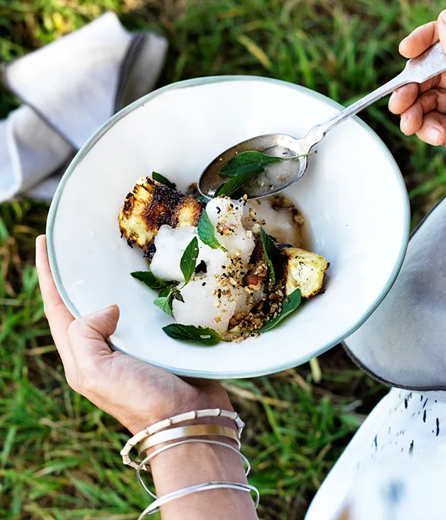 Charred pineapple with lemon and ginger granita, cashew praline and Thai basil