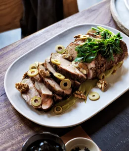 Automata’s slow-roasted pork neck, green olive sauce, parsley and walnuts