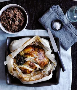 Janni Kyritsis’s chicken baked in clay with pancetta, mushrooms and barley pilaf