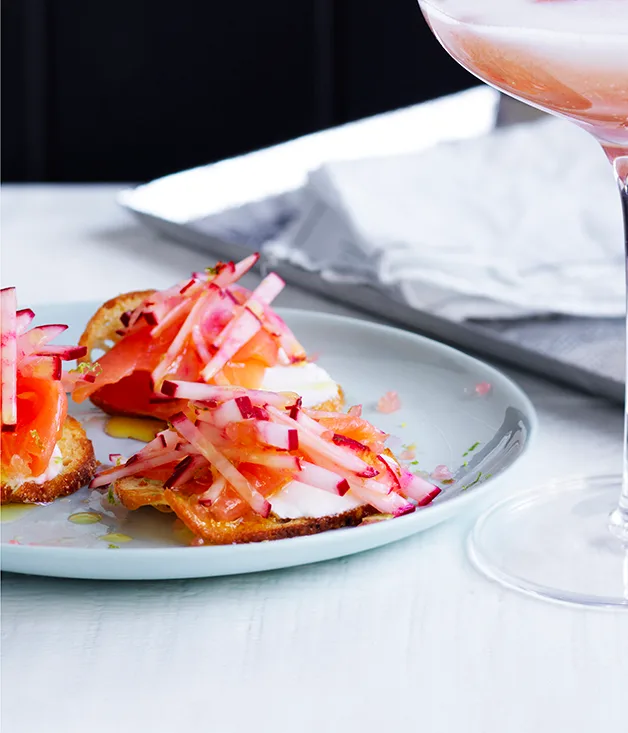 Salmon crostini with pickles and crackers
