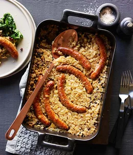 Sausages braised with barley, currants, lemon and silverbeet recipe