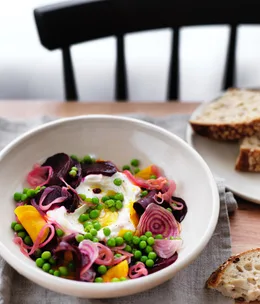 Labne with salt-roasted beetroot, pickled onions and peas
