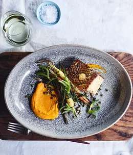 Pan-roasted toothfish with native succulents at Ayers Rock Resort's Mayu Wiru dining experience.