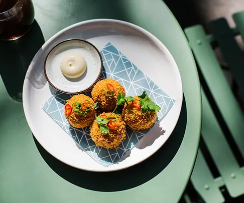 XO arancini, part of the new brunch menu at Potts Point eatery Paper Bird.