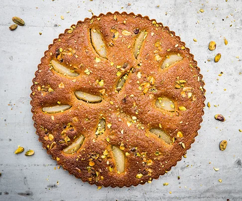 Bourke Street Bakery's pear and pistachio love cake, part of the #BakeForSyria cookbook