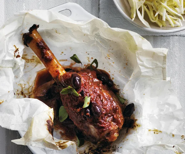 Lamb shanks cooked slowly with olives and red wine