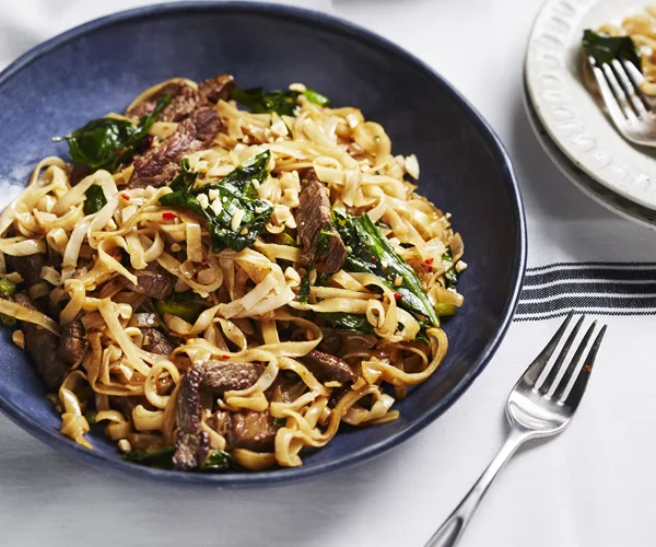 Stir-fried beef and gai lan with rice noodles