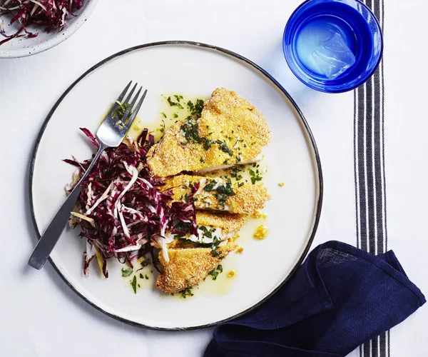 Polenta-crumbed chicken with herb butter