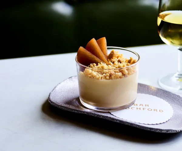 Hay panna cotta with chamomile pears and malt crumb