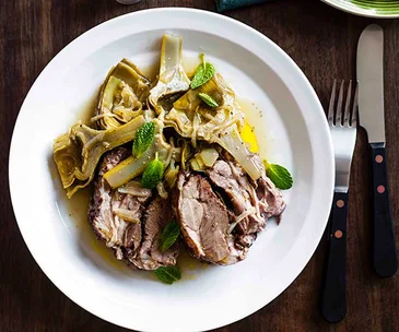 Slow-roasted lamb with sautéed artichokes and mint