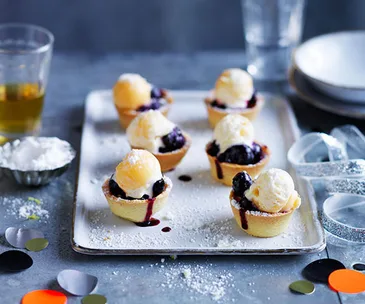 Mini blueberry pies with lemon curd ice-cream and sherbet