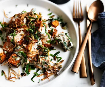 Fried pumpkin with yoghurt-herb dressing and crisp onion