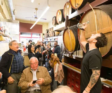Drinking wine from a porrón at Bodega Sant Medir